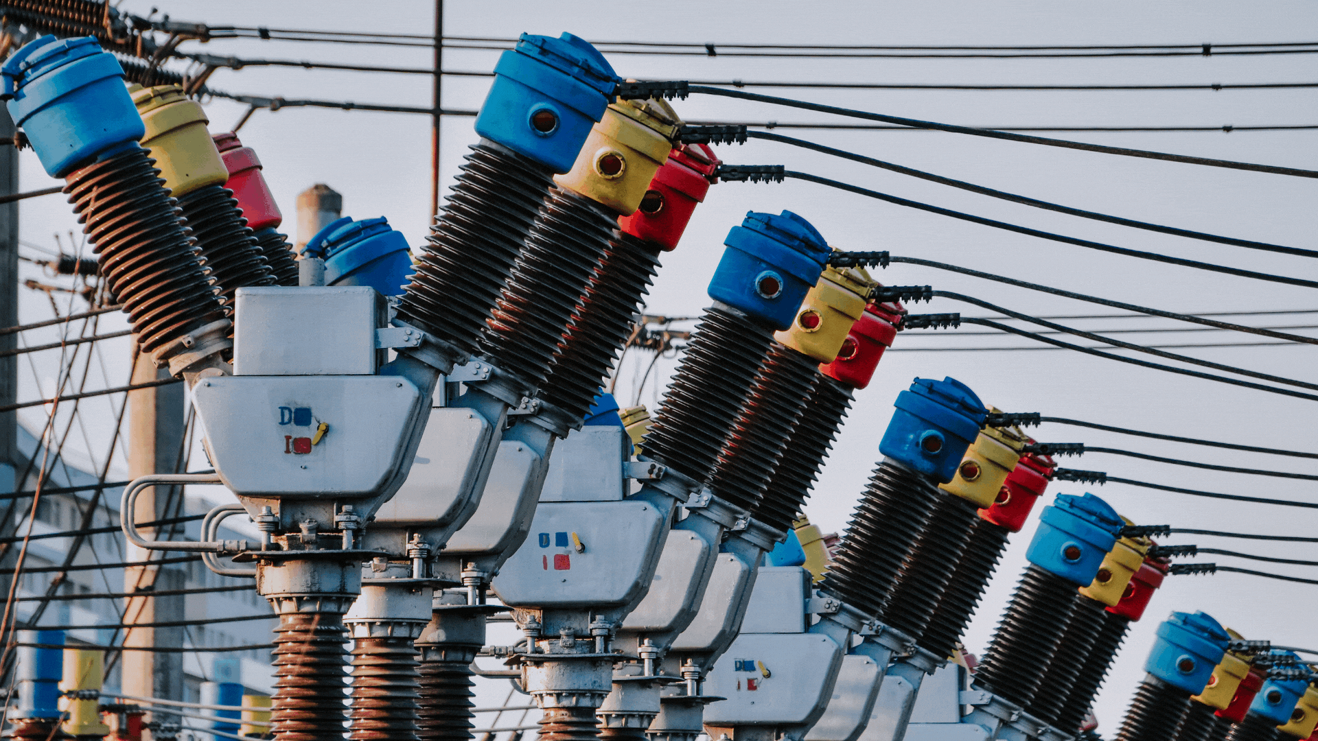 A close-up view of industrial electrical insulators on a power line.